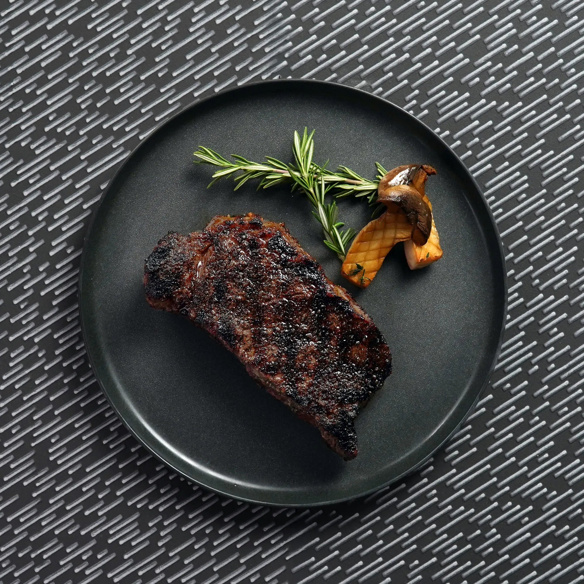 Cooked BNLS Strip on Plate with jazzy background