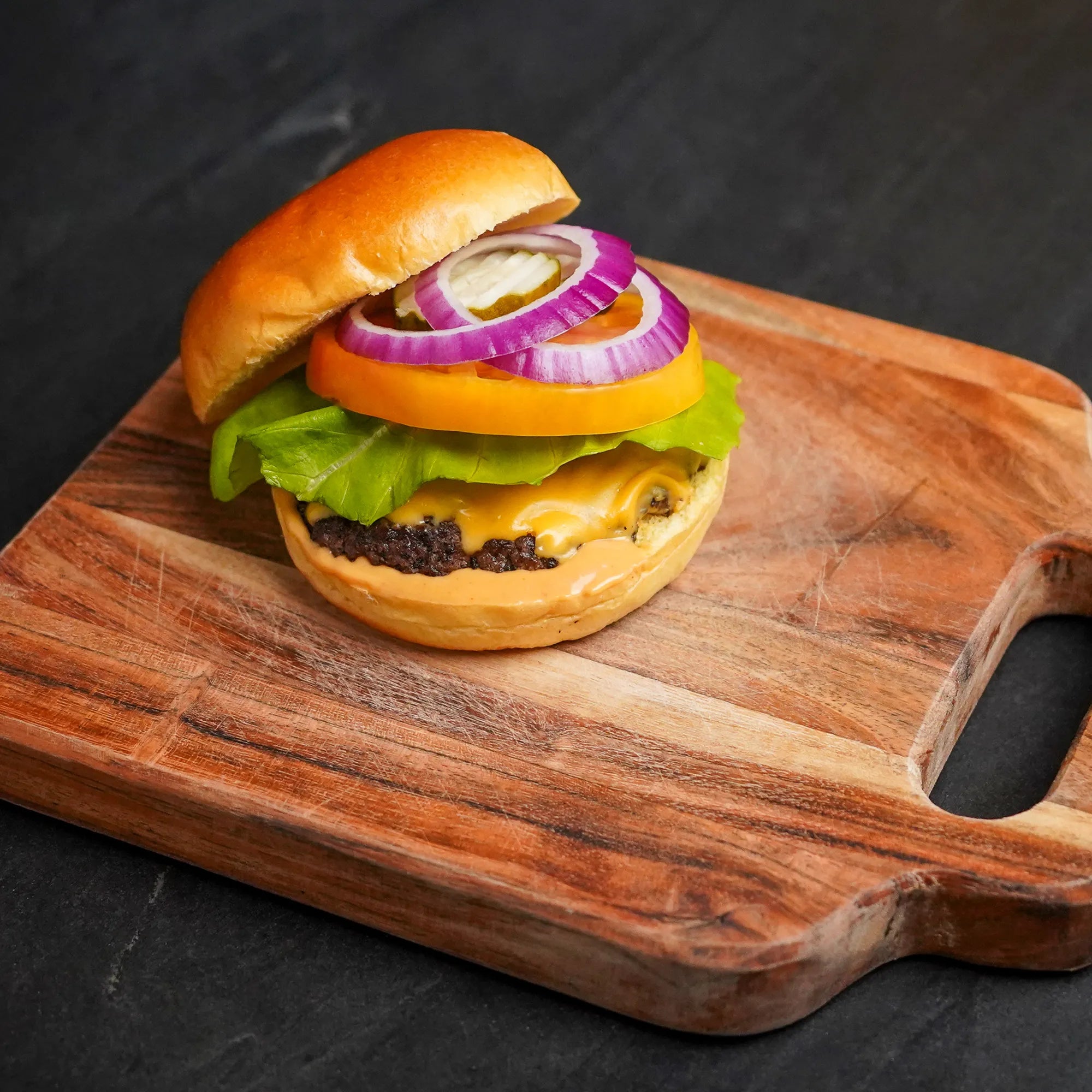 Cheese Burger on Cutting Board