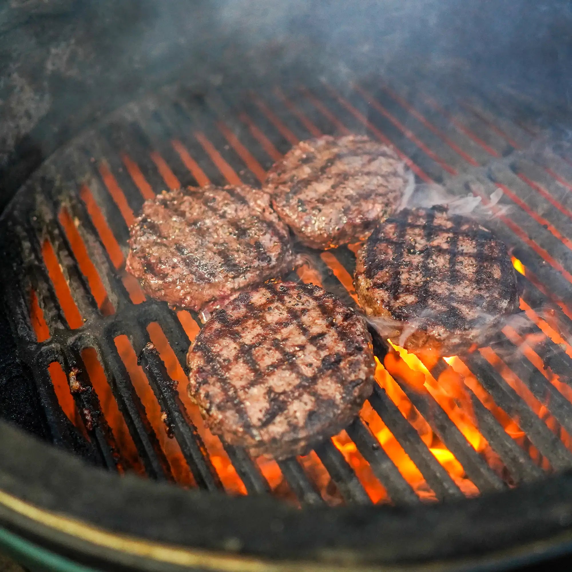 Choice Angus Steakhouse Blend Ground patties grilling with crosshatch marks, showcasing lean, premium quality, ideal for various recipes and a lighter burger experience.