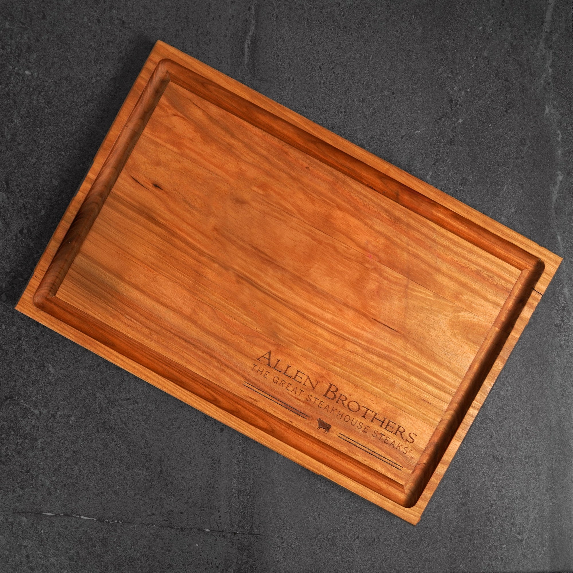Father's Day Box: A large wooden serving board with handles, featuring the Allen Brothers logo, designed for presenting premium steakhouse cuts.