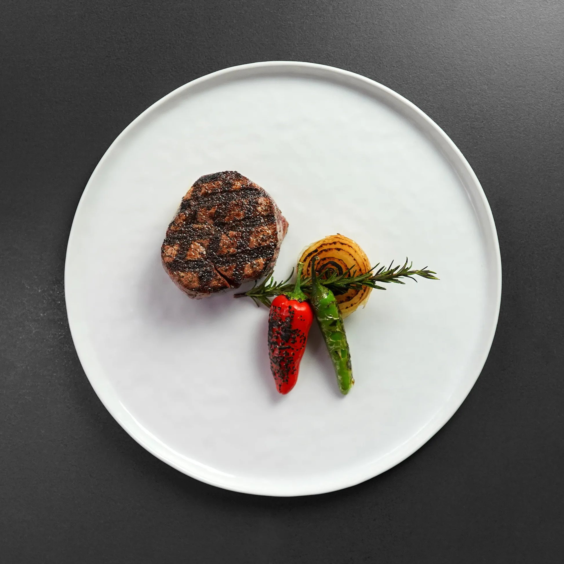 Overhead Close image of cooked filet on White Plate