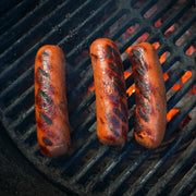 Hot Dogs Cooking on Grill
