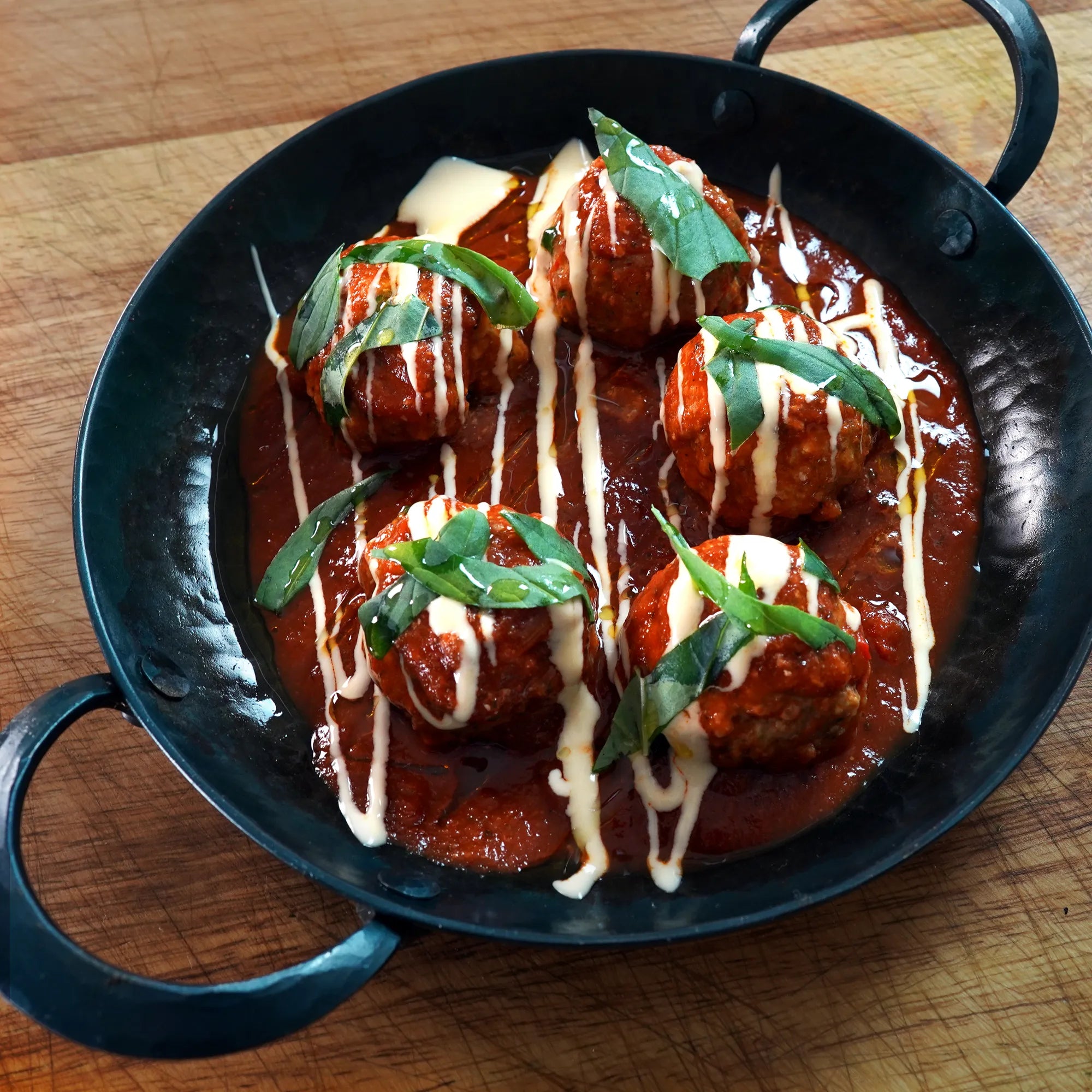 Cooked Meatballs on Butcher board