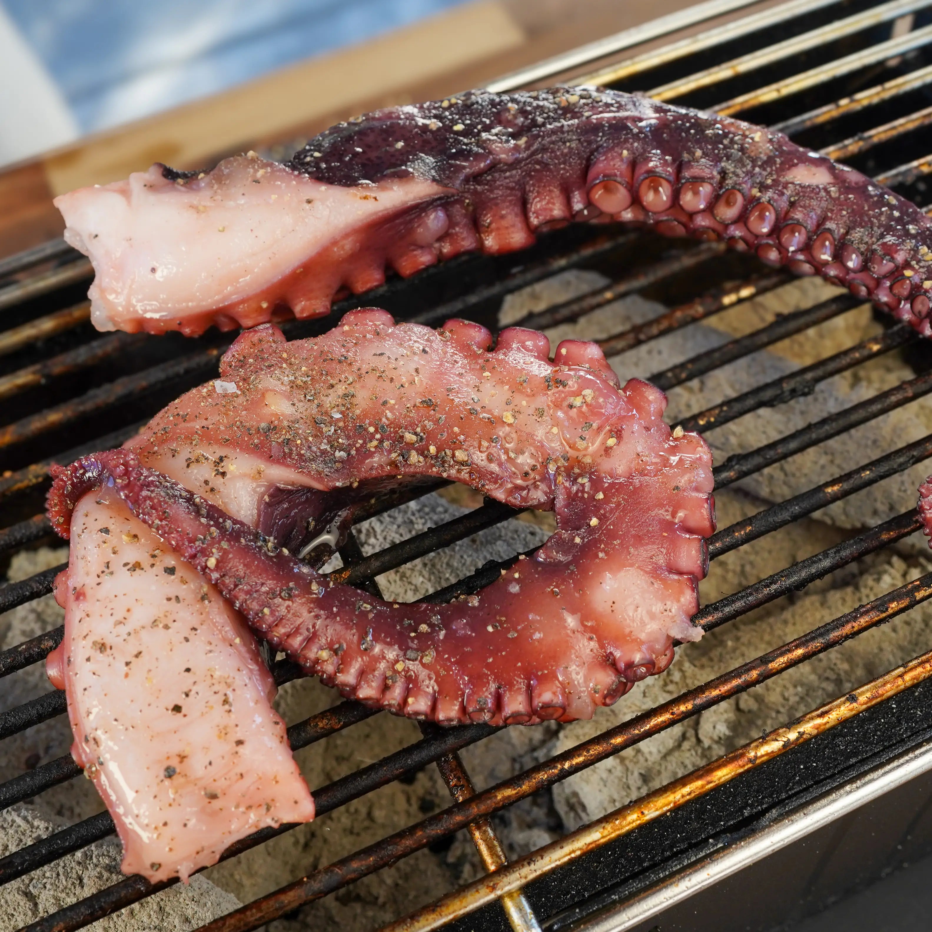 Octopus cooking on grill