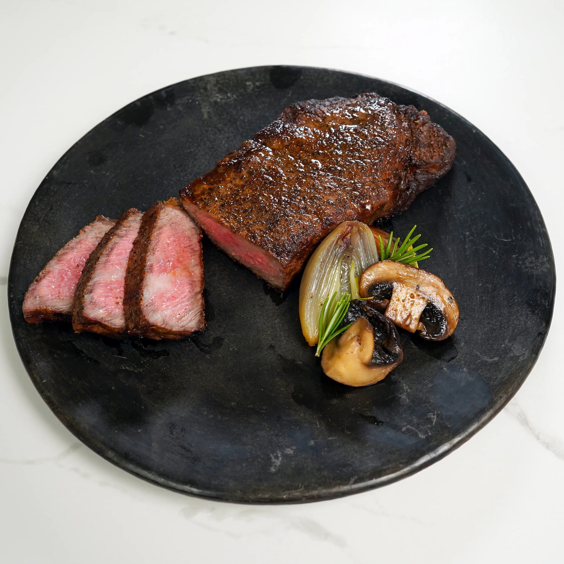Prime Strip Steak Sliced on Plate