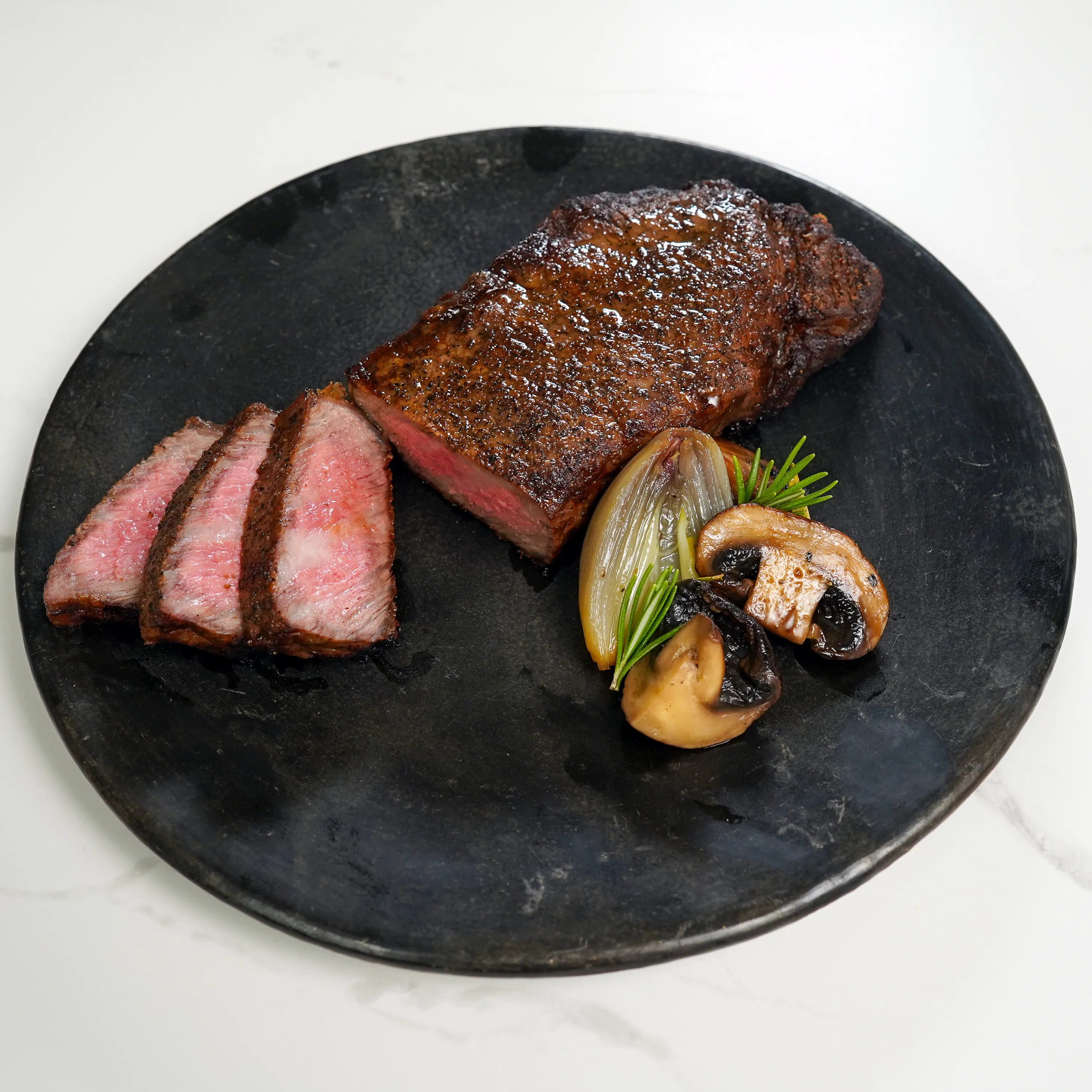 Prime Strip Steak Sliced on Plate