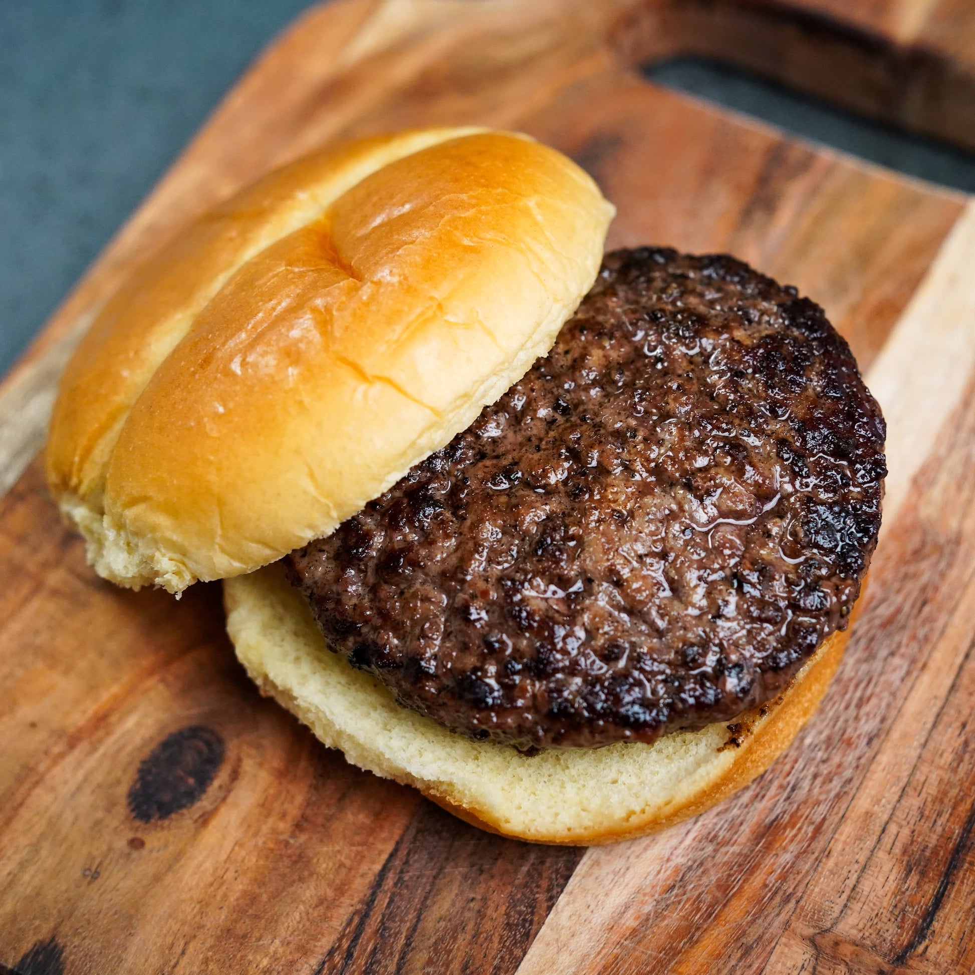 Hamburger on a wooden cutting board