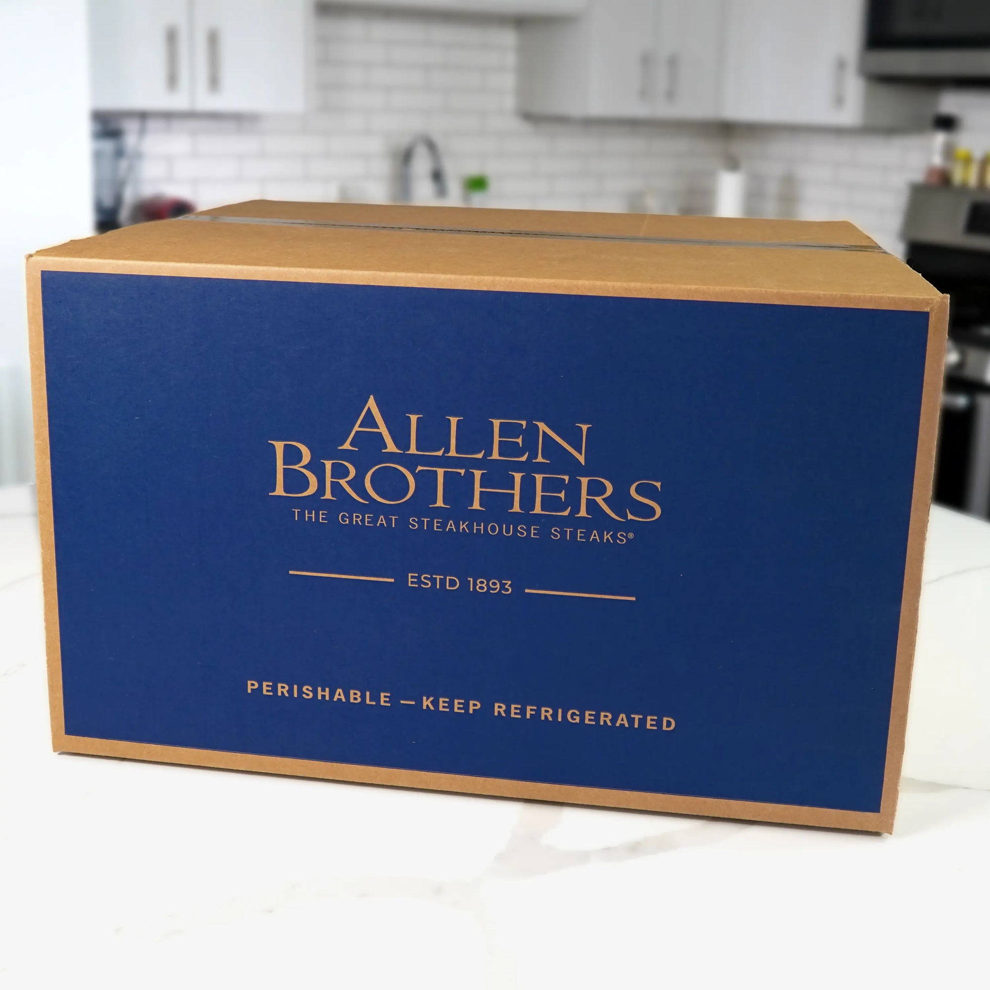 Father's Day Box featuring premium steak cuts packaging on a kitchen counter, highlighting Allen Brothers’ premium steakhouse steaks with a durable artisan cutting board.