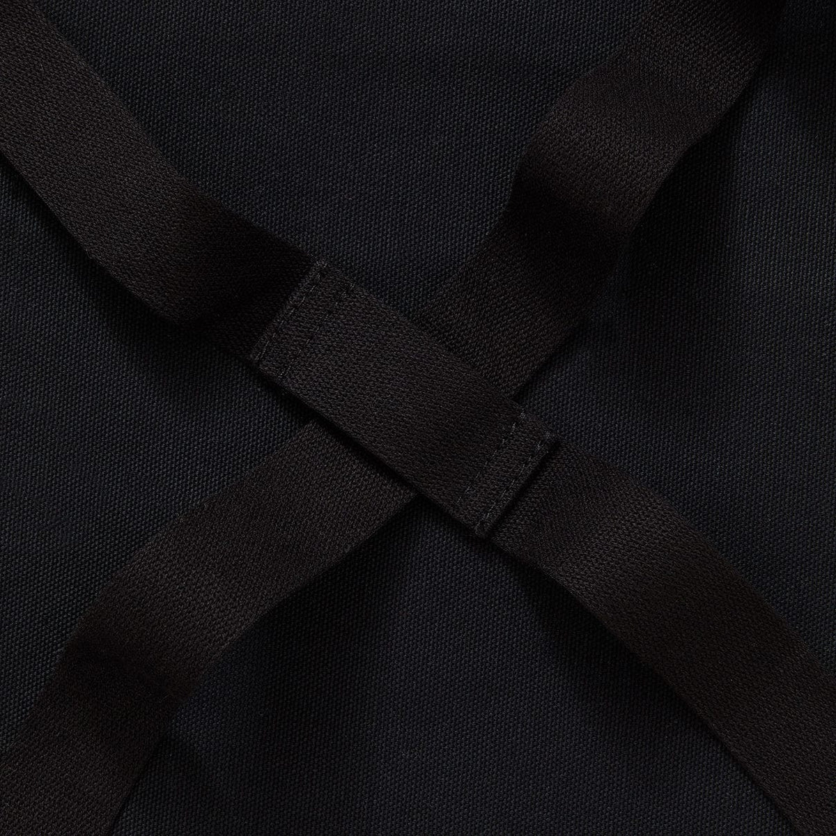 Crossback apron straps crossing at back with adjustable buckle
