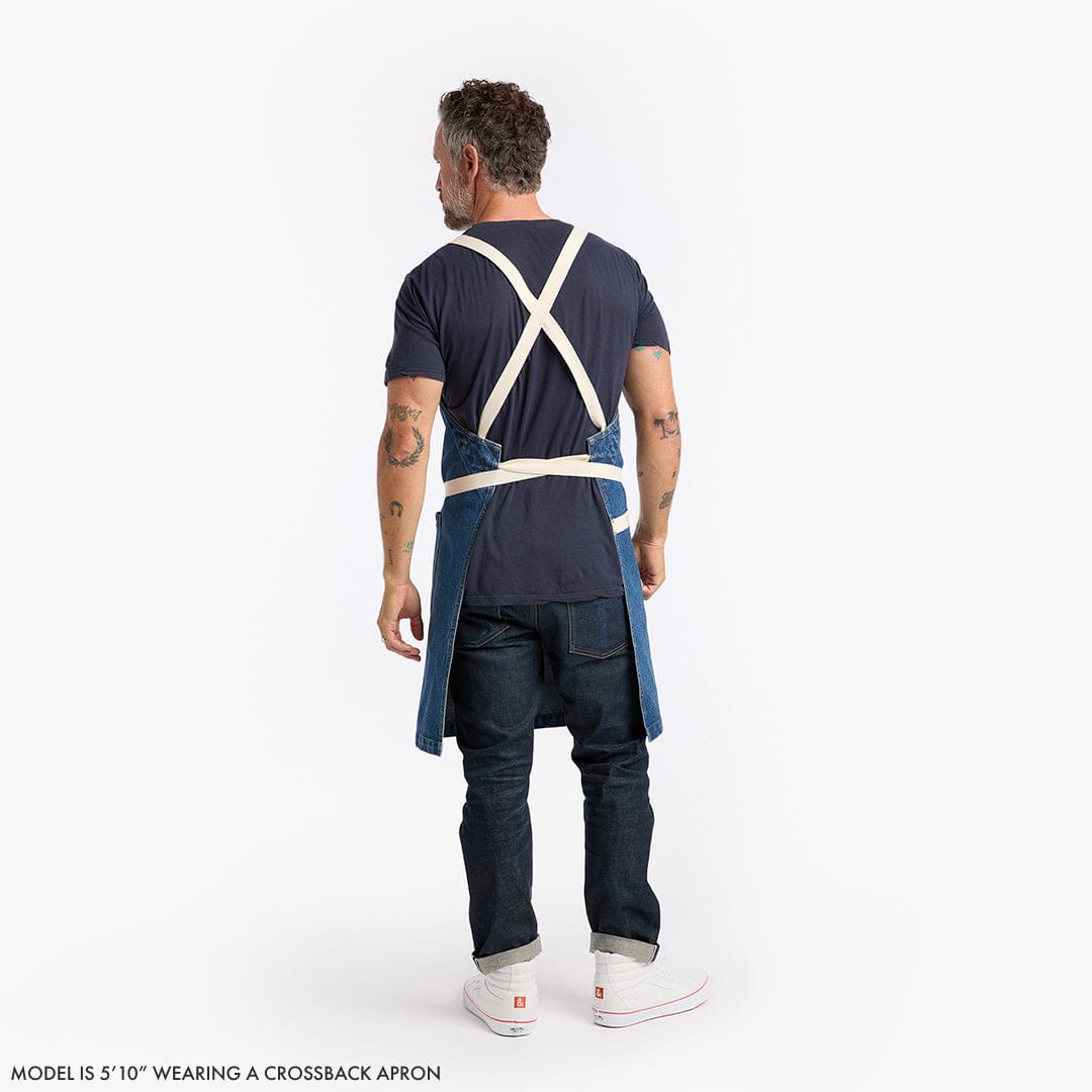 Back view of black crossback apron with X-back straps