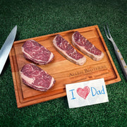 Father's Day Box: Four marbled steaks on Allen Brothers wooden board, flanked by knife and fork, with I ♥ Dad note, for a steakhouse experience.