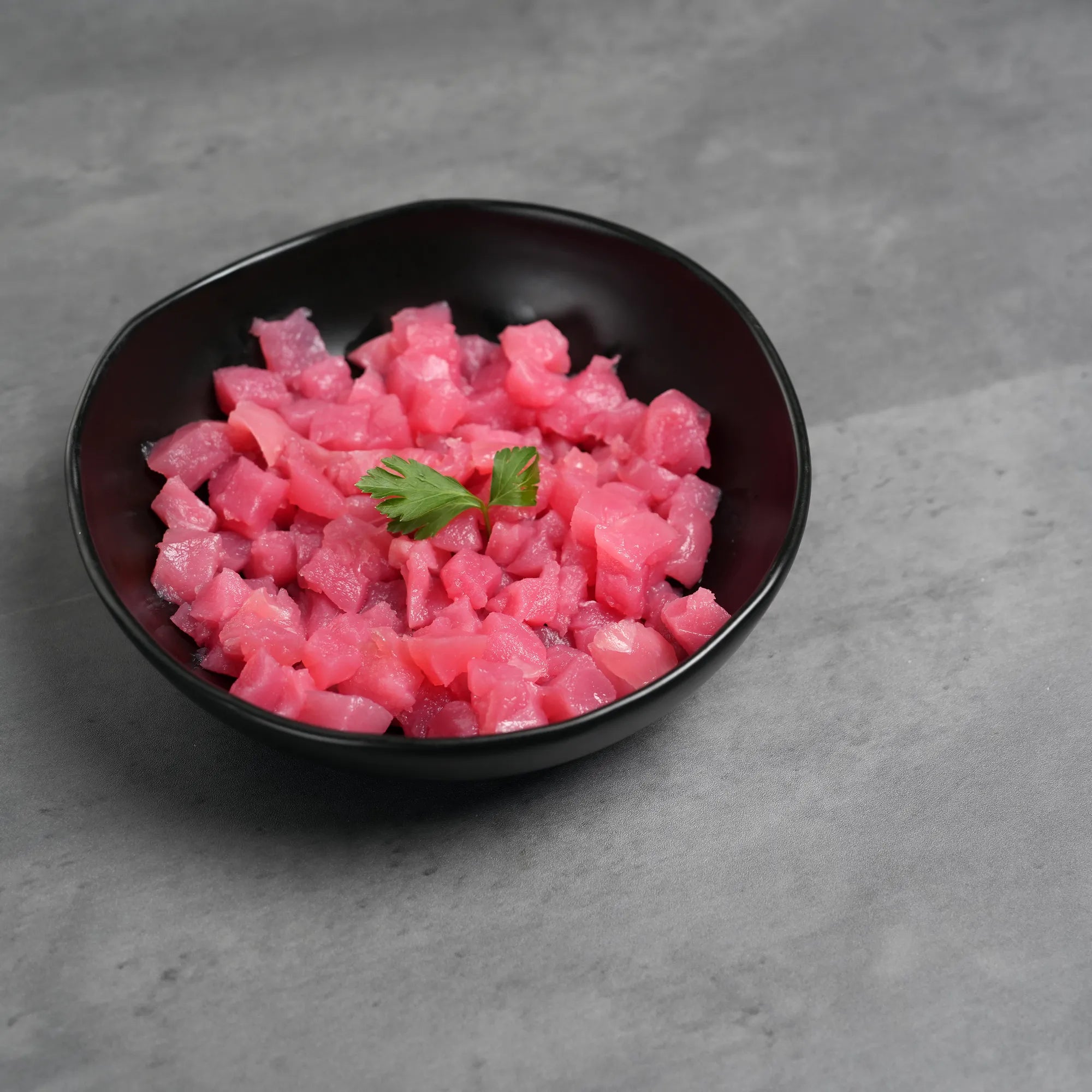 Foley Yellofin Tuna AAA Graded Poke Cubes in a black bowl