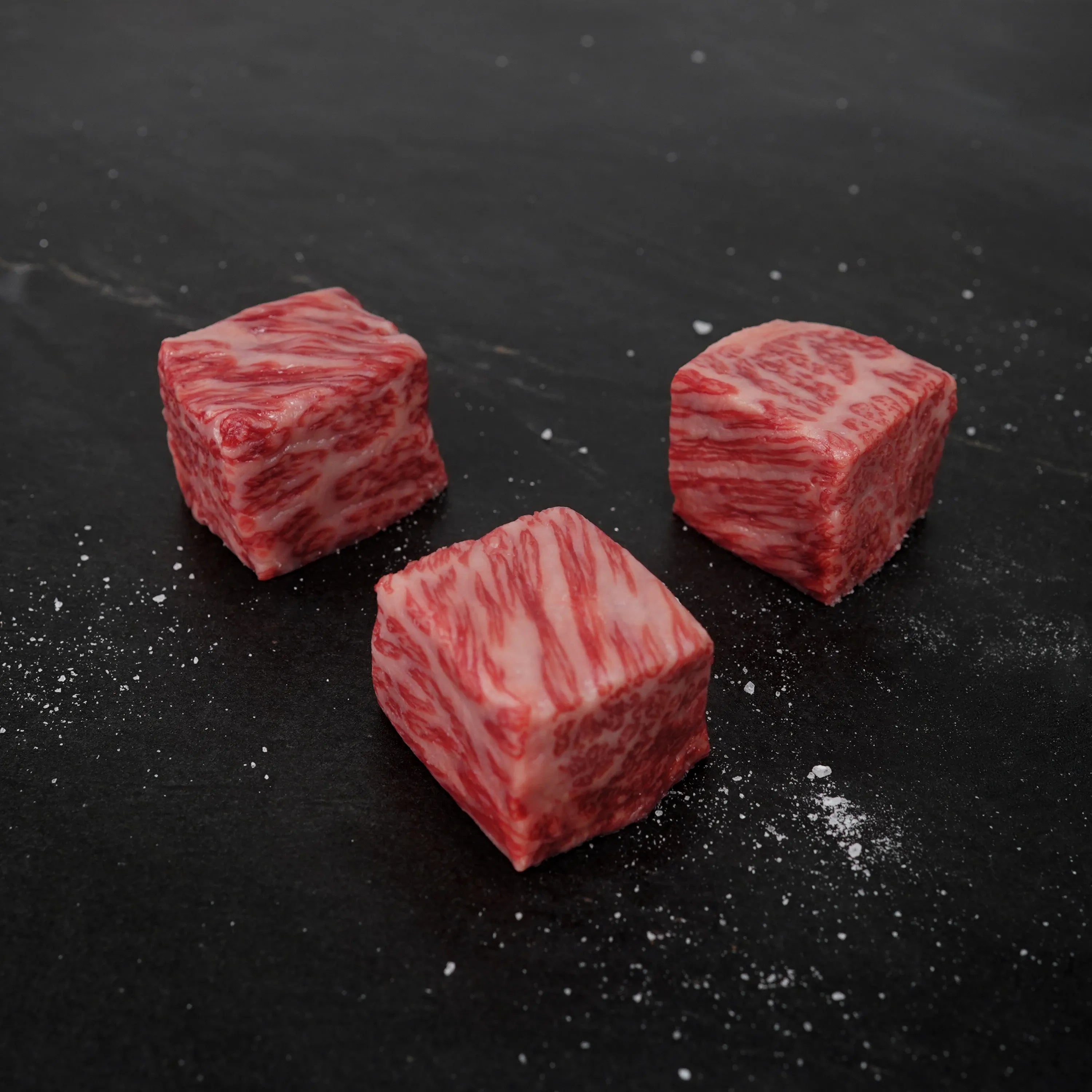 Kobe wagyu cubes on slate
