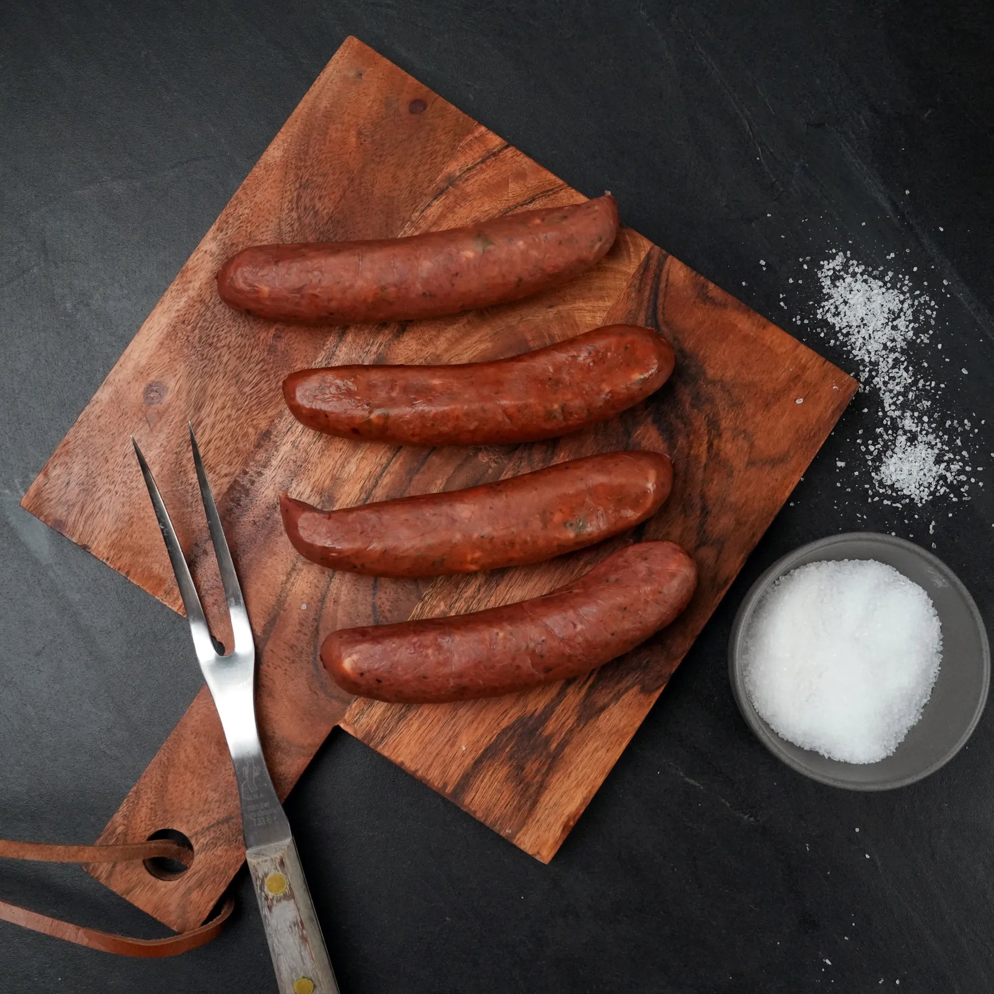 Rosewood Jalapeno Queso Wagyu Sausage on Black