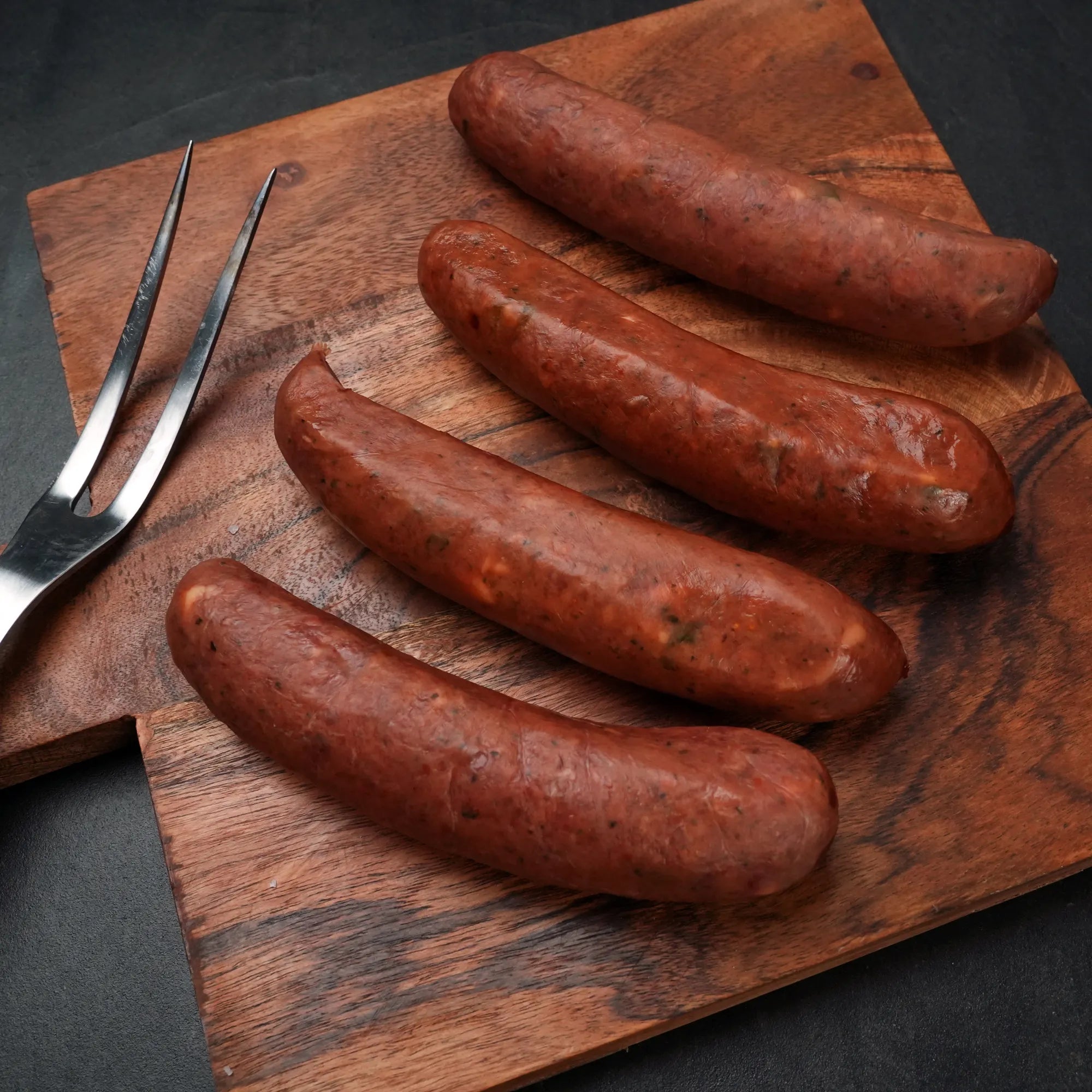 Rosewood Jalapeno Queso Wagyu Sausage on Black
