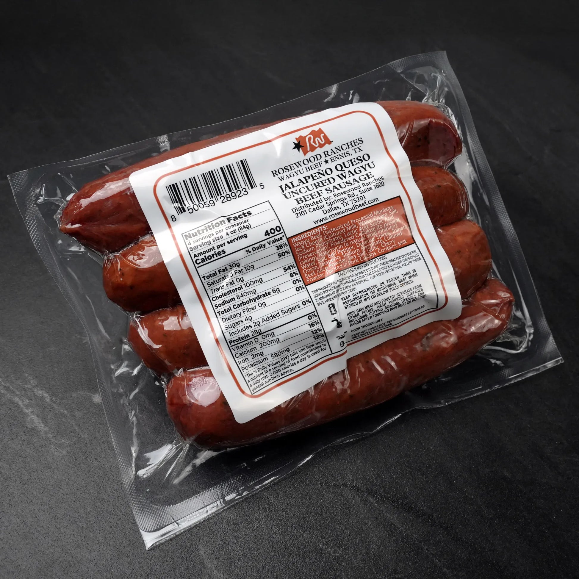 Rosewood Texas Wagyu Jalapeño Queso Sausage in vacuum-sealed pack, featuring buttery Wagyu beef, White Cheddar, and pico de gallo for rich, spicy flavor.