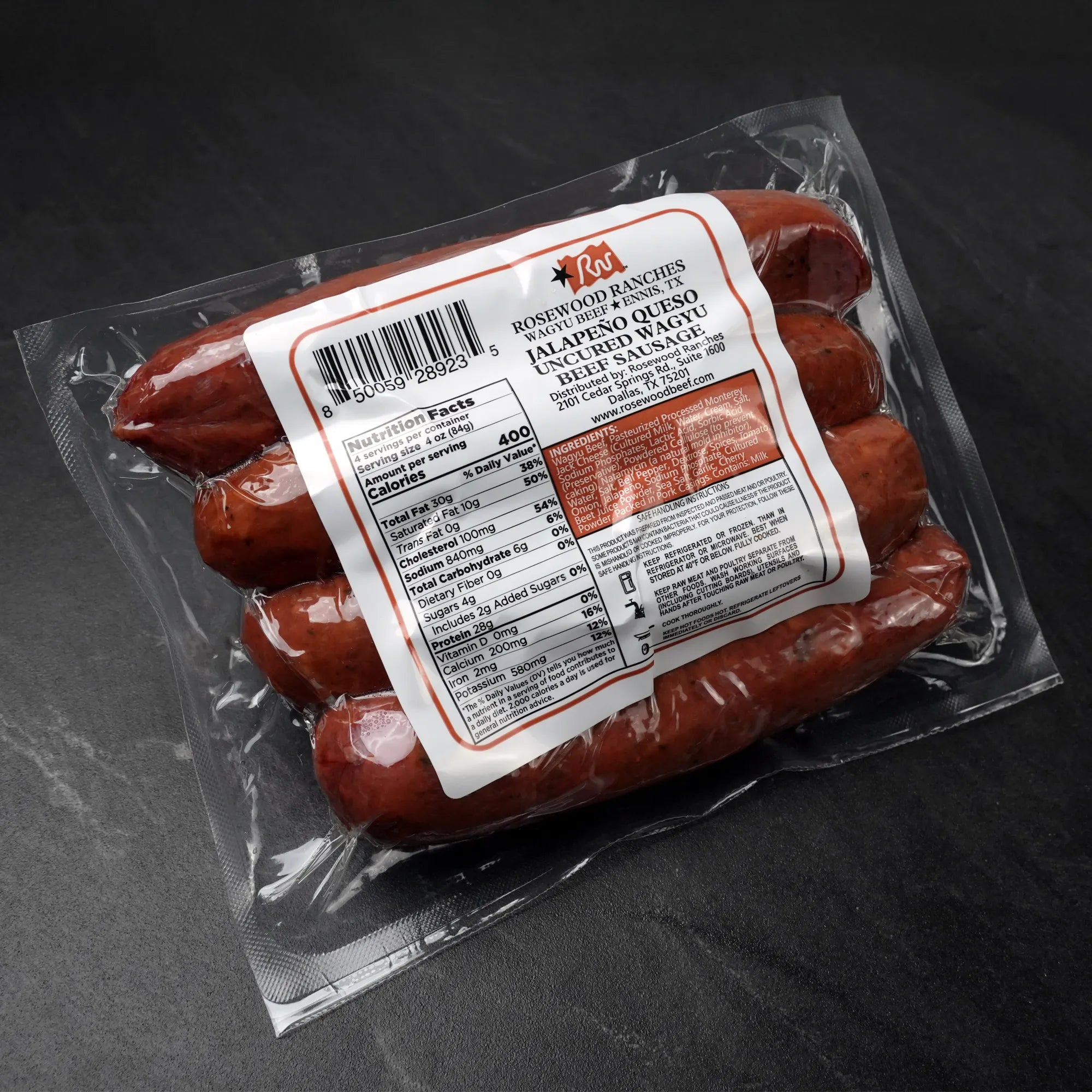 Rosewood Texas Wagyu Jalapeño Queso Sausage in vacuum-sealed pack, featuring buttery Wagyu beef, White Cheddar, and pico de gallo for rich, spicy flavor.