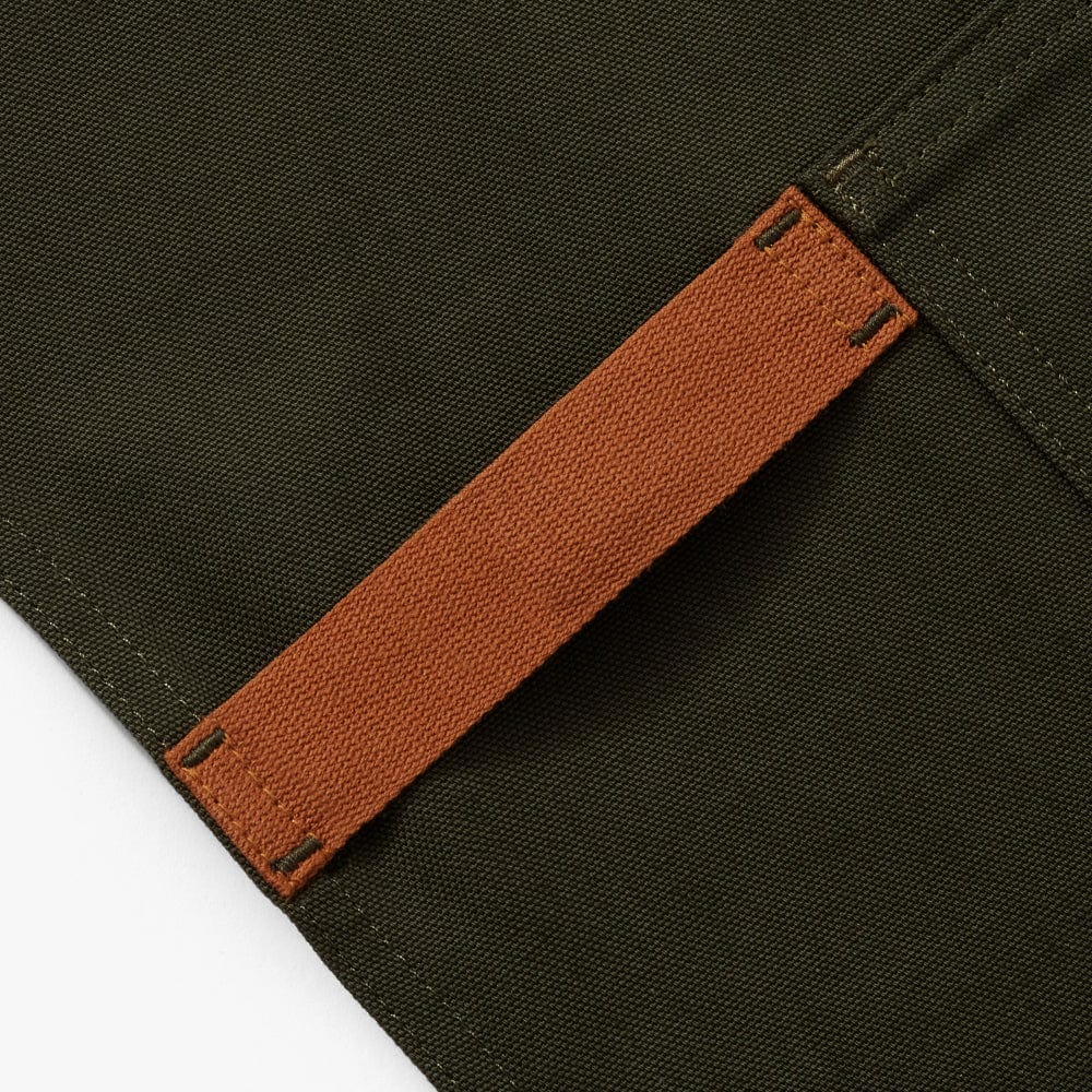 Olive apron waist strap with tan-orange tie and stitched fastening