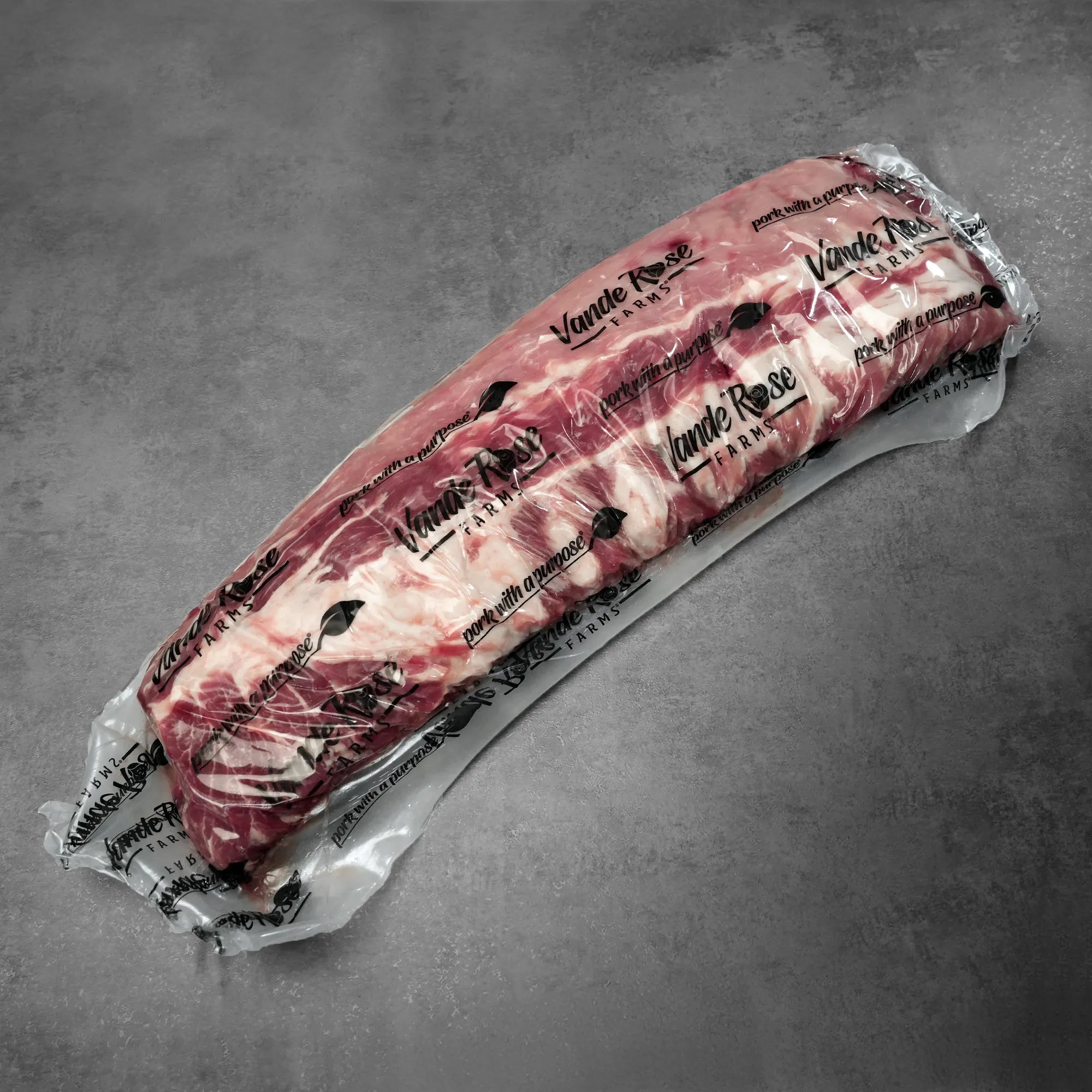 Heritage Duroc Pork Peeled Baby Back Ribs, vacuum-sealed, branded Vande Rose Farms, showcasing premium heritage quality, ready for grilling, smoking, or baking.