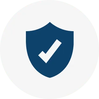 A dark blue shield icon with a white checkmark inside, centered on a light gray circular background.