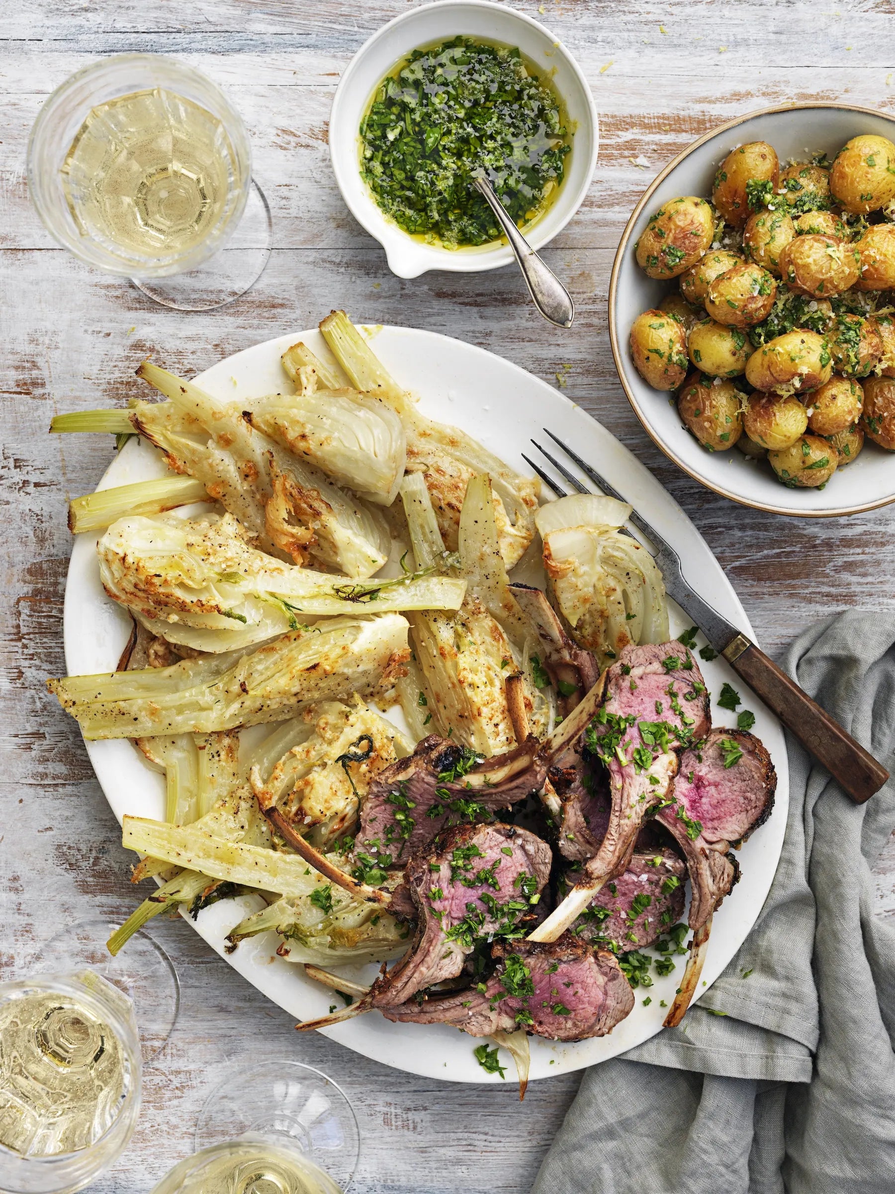 Lamb chops and vegetables on white platter