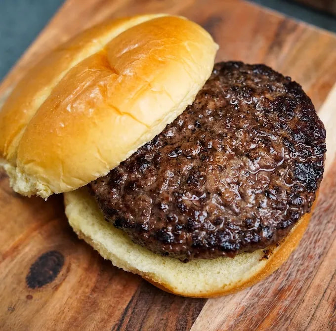 Choice Angus Steakhouse Blend Ground: plain hamburger with toasted bun and beef patty, representing a lean, versatile option ideal for various recipes.